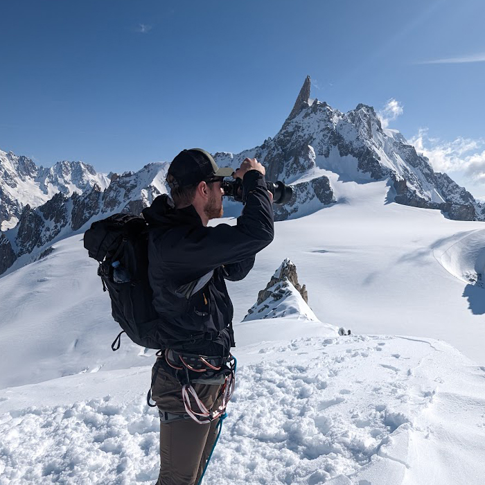 Photograph of Aaron Harris, film maker in Mont Blanc for Outlier Ascents, UK based Mont Blanc climbing tour package